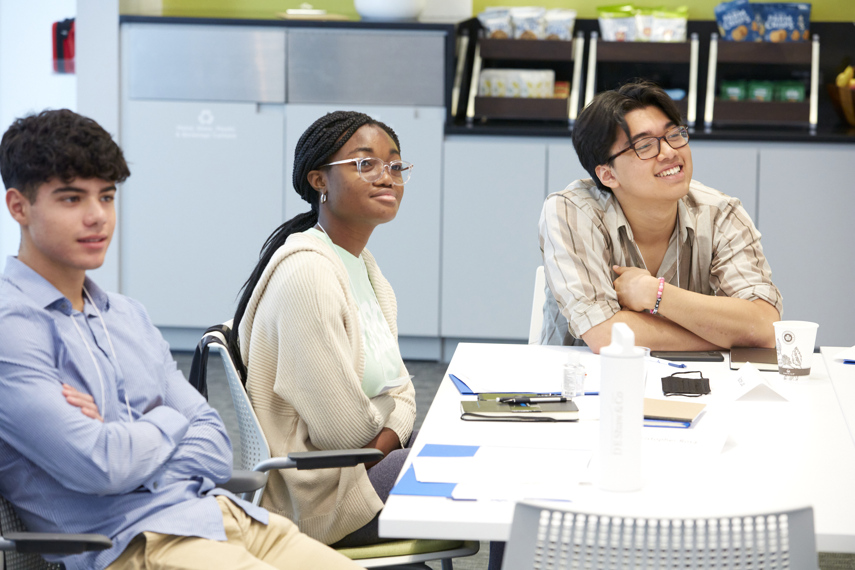 Latitude fellows listen to a panel on Community and Life at the D. E. Shaw group.