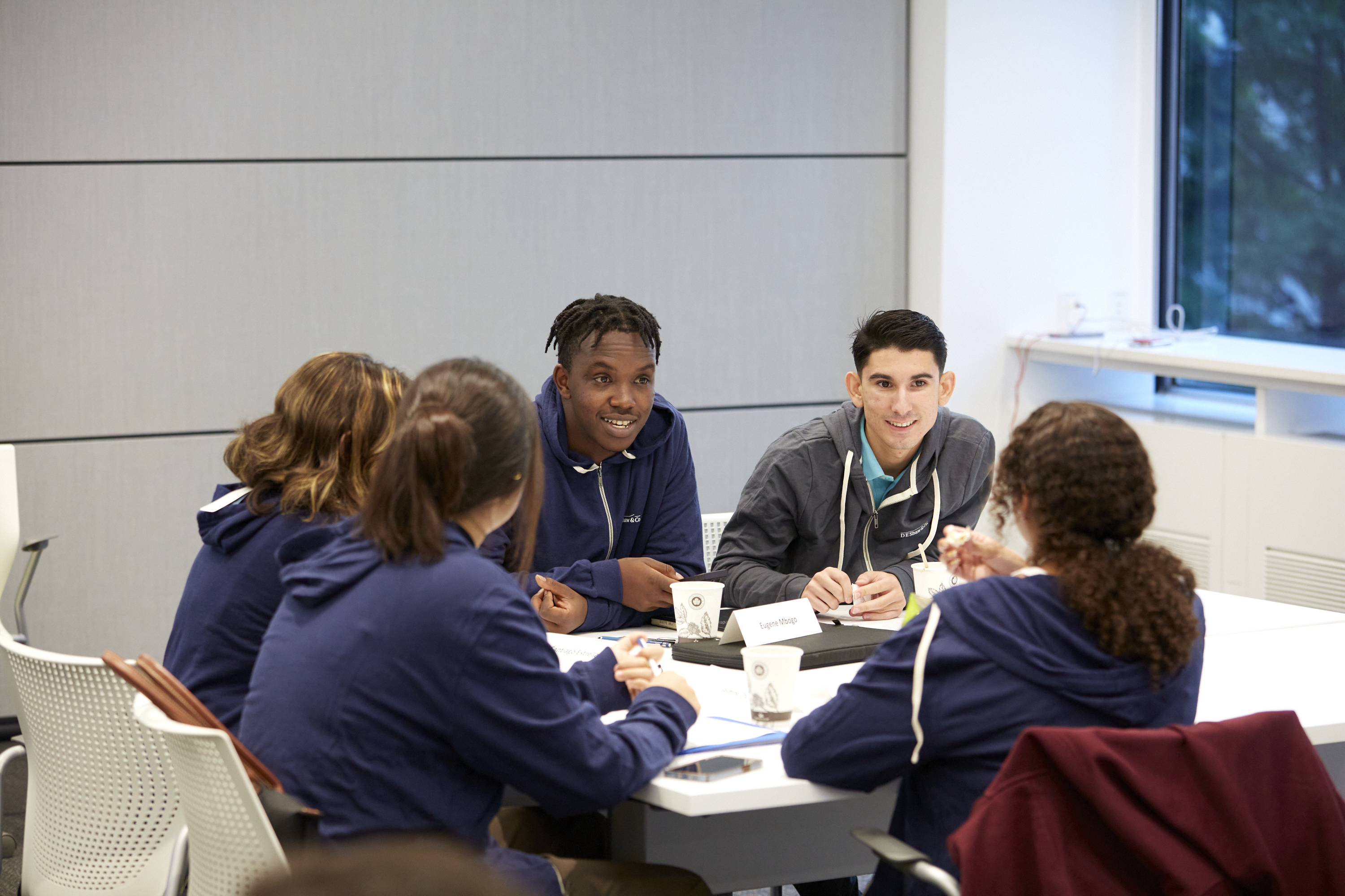 A group of students discuss in the aftermath of a panel.